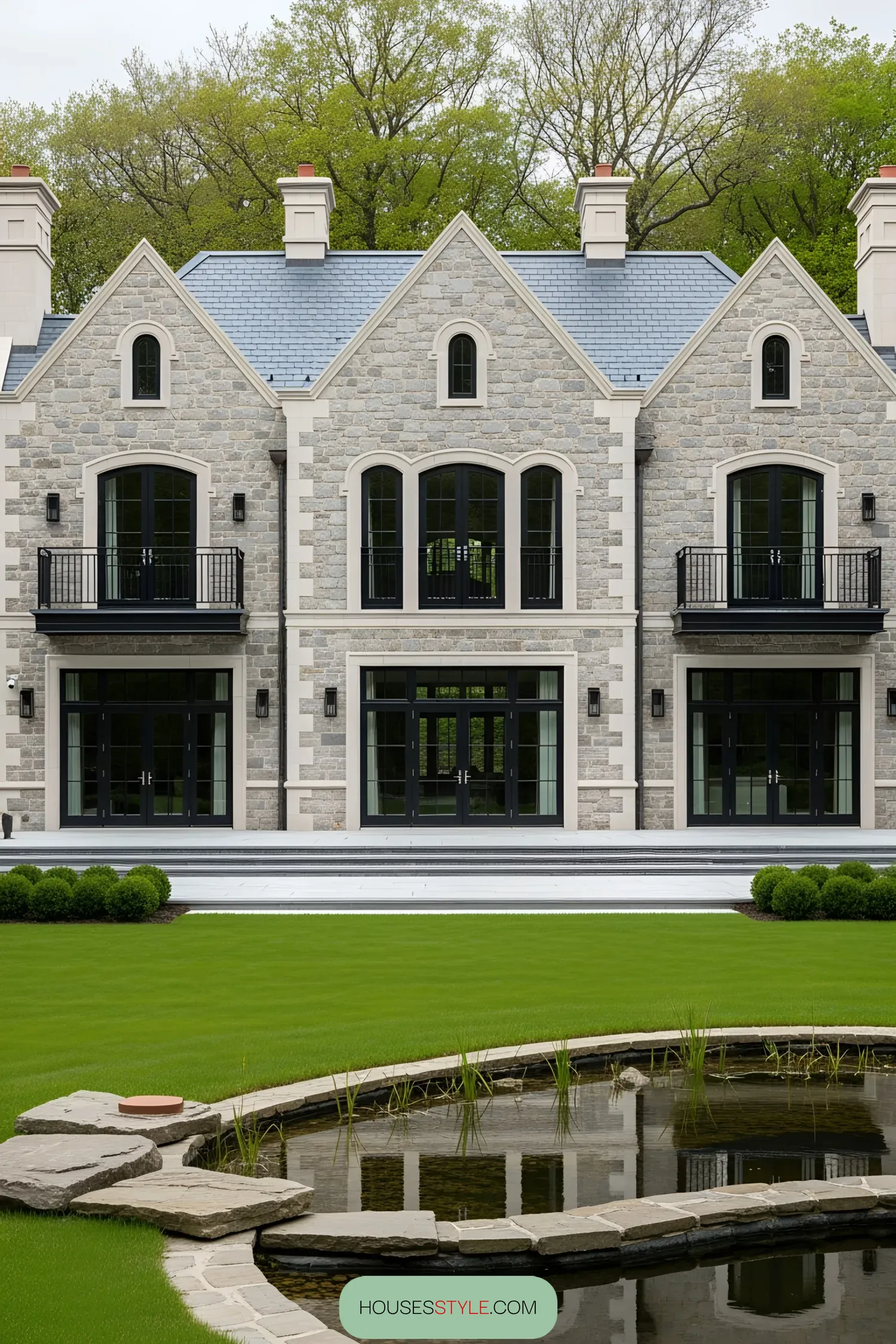 Elegant manor house with stone exterior and large windows