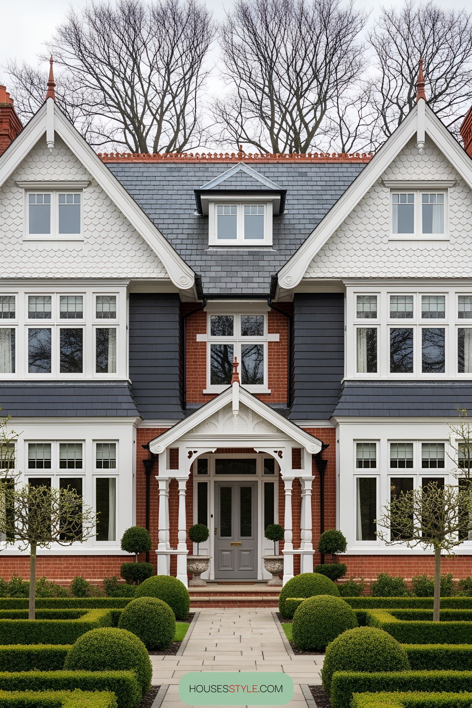 Victorian villa with ornate entrance and manicured bushes
