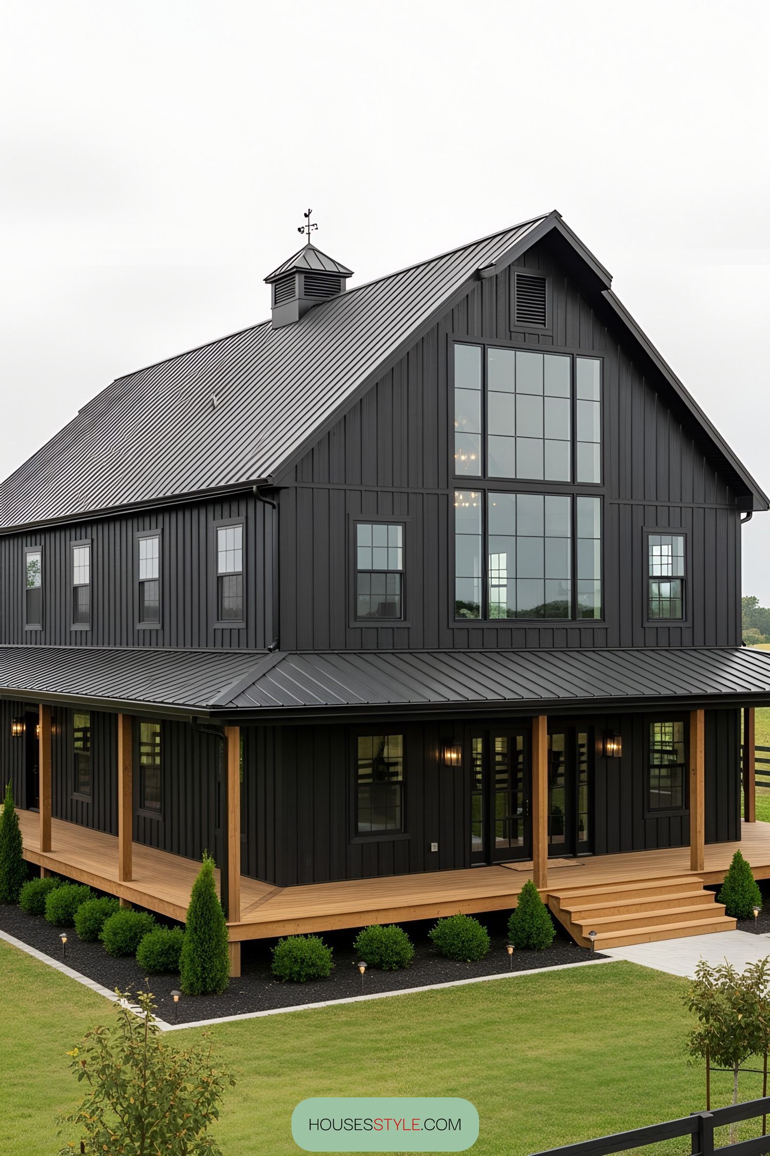 Sleek black barn house with large windows